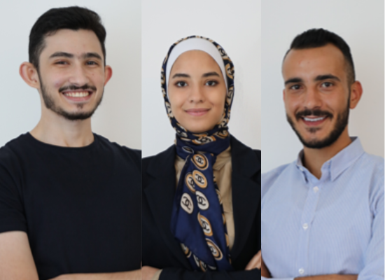 two arabic looking men and a woman waering a headscarf smiling into camera (portrait photo)