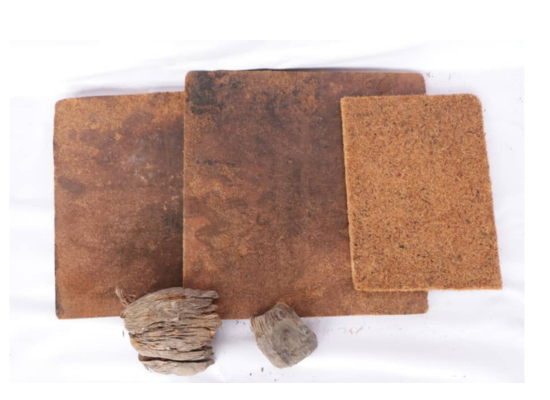prototype of a panel made from coconut husk ( brown wooden-looking sheet)
